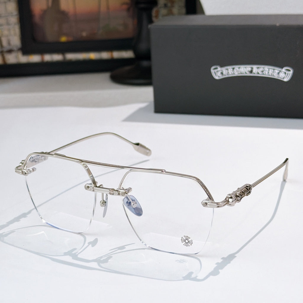 Silver metal eyeglass frames with clear lenses and decorative temple accents