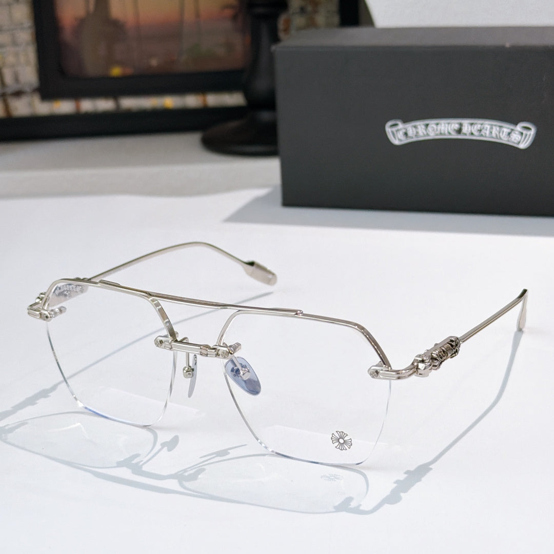 Silver metal eyeglass frames with clear lenses and decorative temple accents