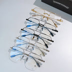 Set of metal eyeglass frames with clear lenses in gold, blue, and black