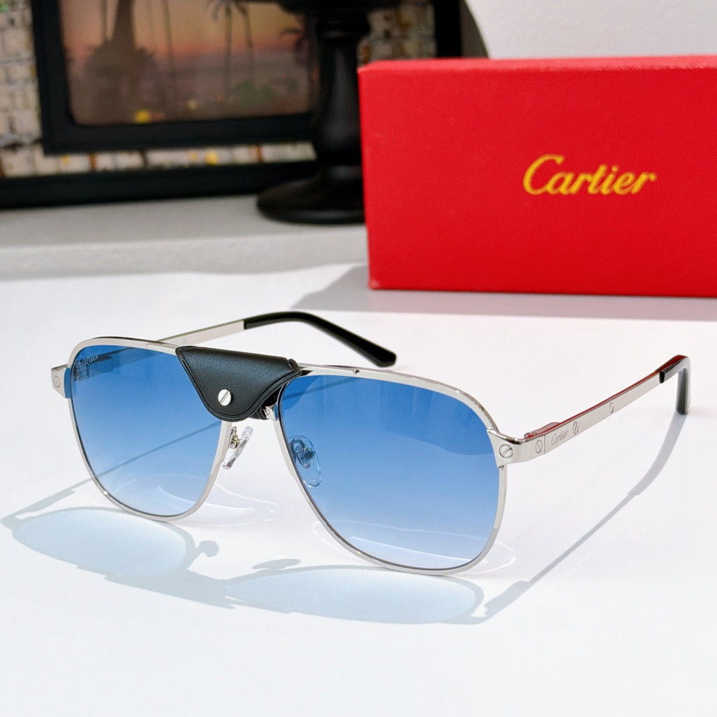 Sunglasses with silver frames, blue tinted lenses, and black leather detail at the bridge