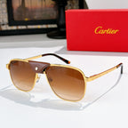 Sunglasses with gold frames, amber tinted lenses, and black leather detail at the bridge