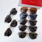 Assorted sunglasses with metal frames and tinted lenses, stacked