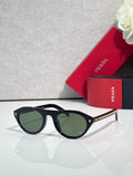 Prada sunglasses with black frames and dark green lenses