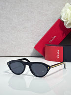 Prada sunglasses with black frames and dark gray lenses