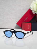 Prada sunglasses with black frames and blue tinted lenses