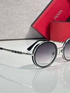 Prada round eyeglasses, dark lens side view, silver arm with PRADA logo