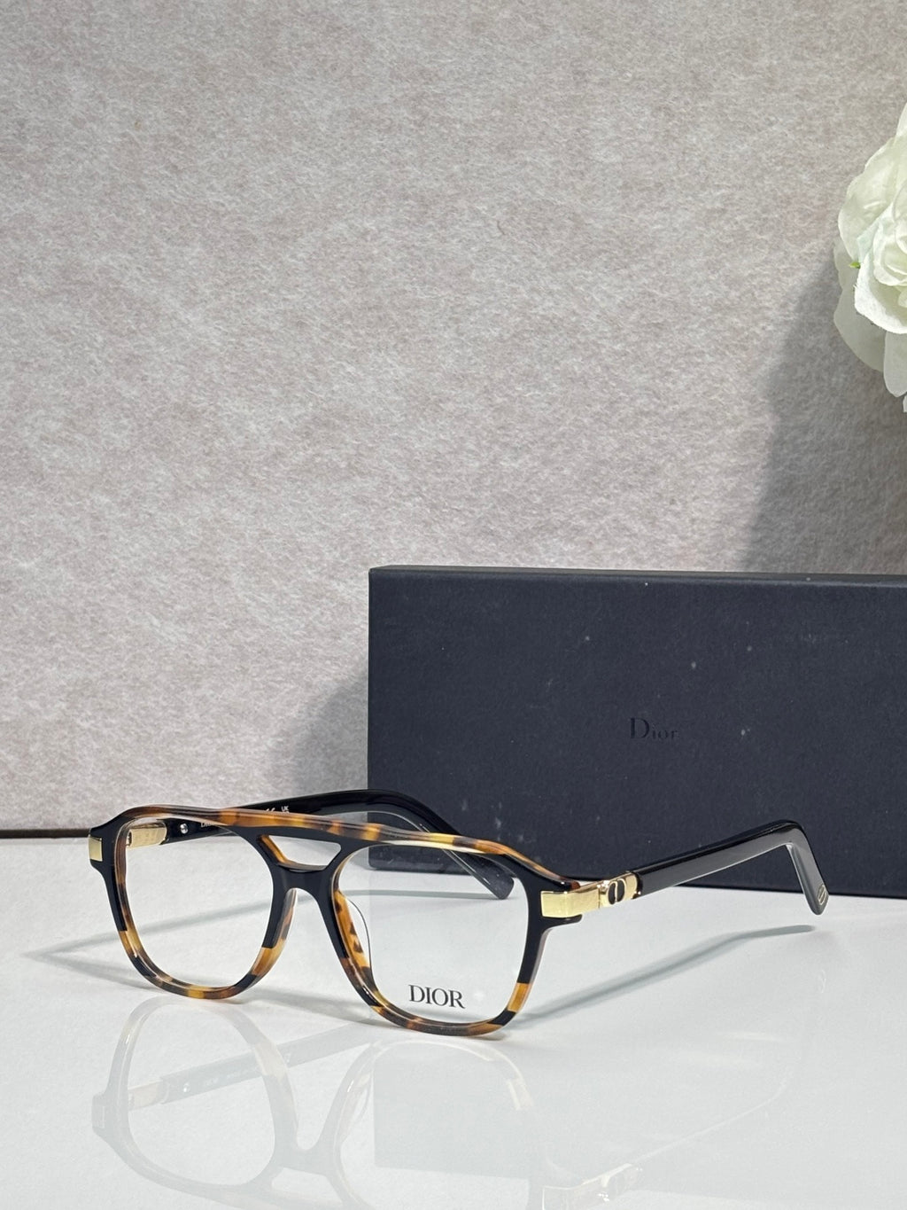 Rectangular eyeglasses with tortoiseshell frame and clear lenses, Dior logo on bridge