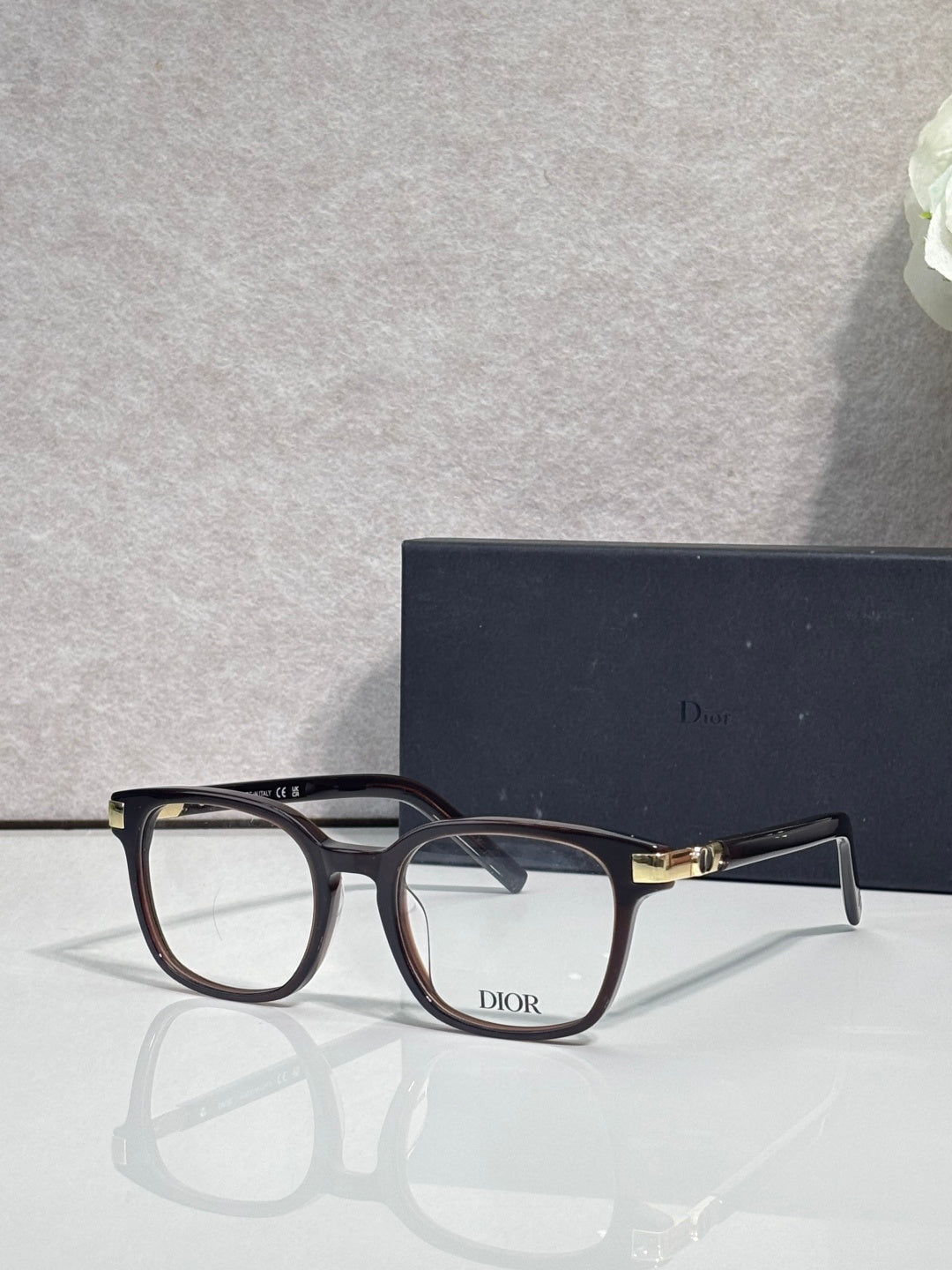 Dior eyeglasses with dark navy acetate frames and rectangular clear lenses