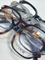 Assorted Dior eyeglasses with clear and tortoiseshell frames and clear lenses