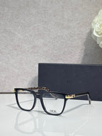Dior optical glasses with dark frames and leopard-pattern detail on the upper temple.