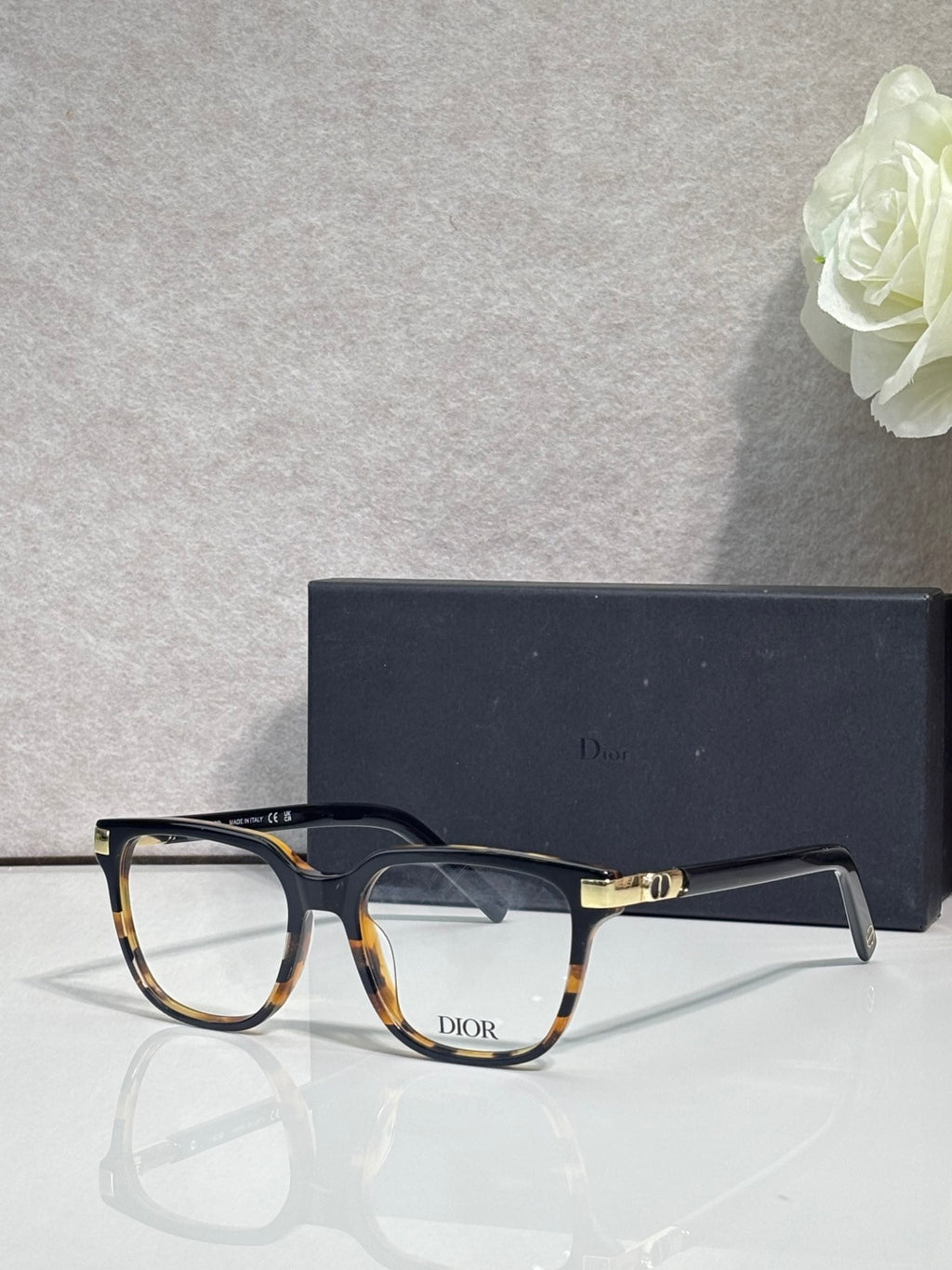 Dior eyeglasses with tortoiseshell frames and gold-toned temple hardware.