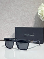 Designer glasses with dark frame and dark square lenses, glossy finish