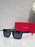 Prada sunglasses with dark navy rectangular frames and smoky black lenses