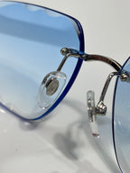 Cartier eyeglasses close-up, blue temples, metal hinges, clear lenses