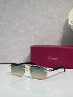 Cartier eyeglasses, black frame with gold temples, gold reflective lenses