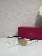 Cartier eyeglasses, black frame with gold temples, amber-tinted lenses