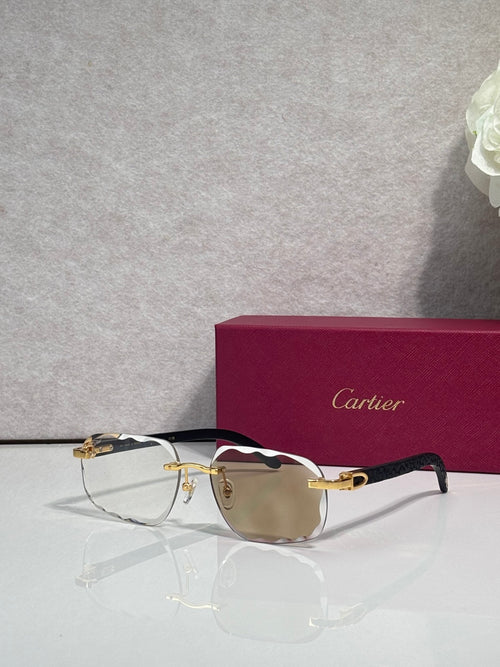 Cartier eyeglasses, black frame with gold temples, amber-tinted lenses