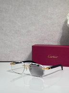 Cartier eyeglasses with dark acetate frame, gold temples, clear lenses