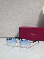 Blue-tinted frame eyeglasses with light blue lenses and gold-tone accents