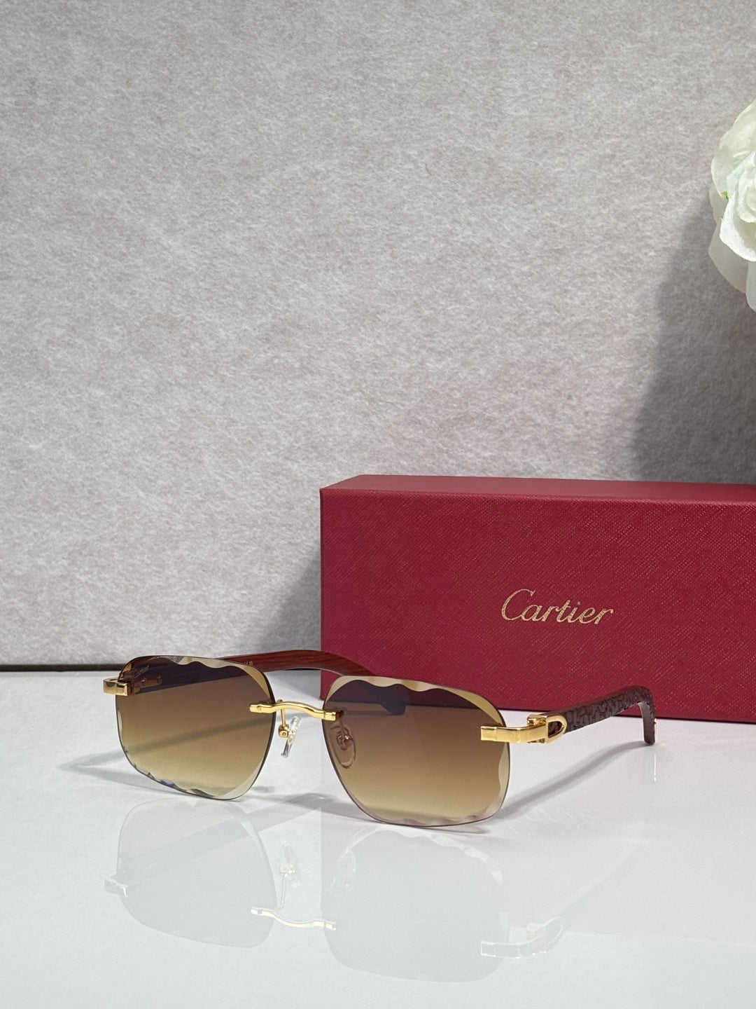 Brown frame eyeglasses with gold-tinted lenses and gold-tone hardware