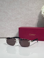 Black frame eyeglasses with dark brown lenses and gold-tone hardware