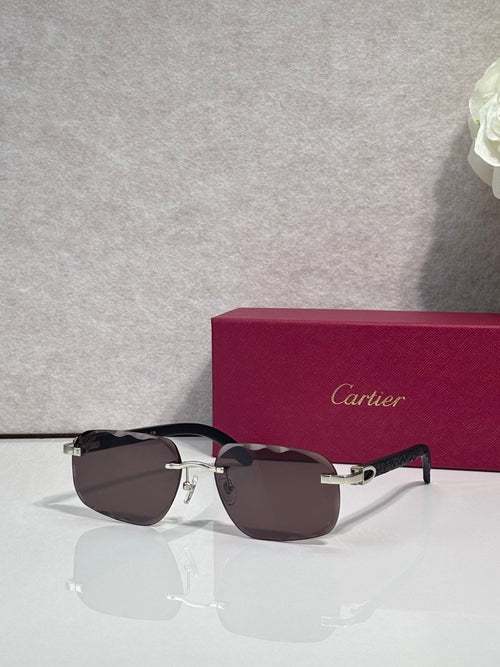 Black frame eyeglasses with dark brown lenses and gold-tone hardware