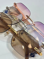 MiuMiu sunglasses with mixed metal frames, tinted lenses, and jeweled temple details