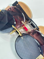 Overlapping round sunglasses with gold-tone frames and dark tinted lenses