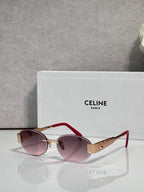 Red round sunglasses with gold-tone hinges and purple tinted lenses
