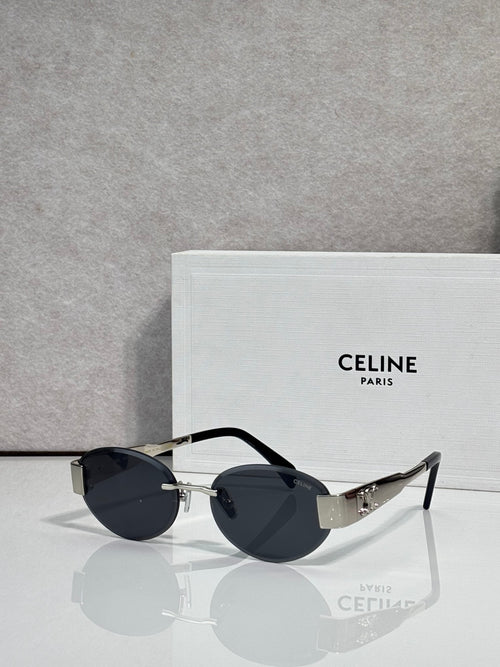 Celine glasses with black round frames and dark tinted lenses, gold hinge details