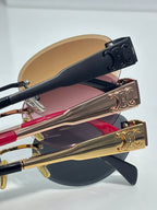 Celine glasses close-up of multiple frames with gold and navy temple details