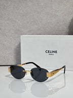 Celine glasses with black frames and dark lenses, gold accents on hinges