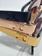 Celine glasses close-up of gold hinge and embossed temple detailing on frame