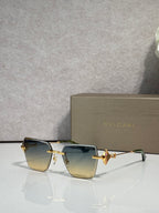 Gold-framed rectangular sunglasses with blue gradient lenses and butterfly bridge charm