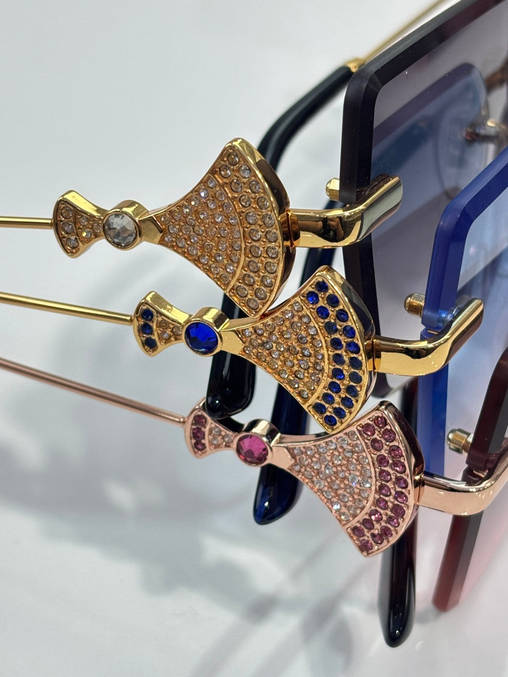 Gold butterfly embellishment with rhinestones on sunglasses frame