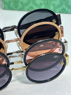 Gucci sunglasses cluster with oval frames in mixed colors and dark tinted lenses