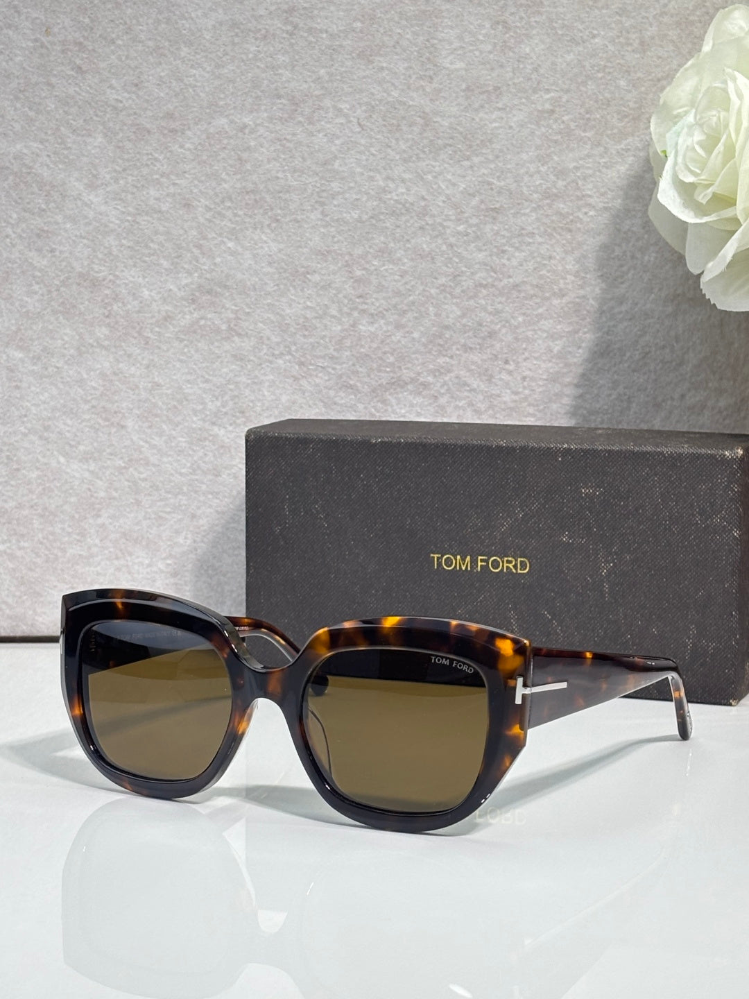 Square sunglasses with tortoiseshell frames and dark brown-tinted lenses, TOM FORD temple branding