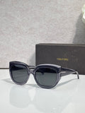 Square sunglasses with navy frames and dark gray lenses, TOM FORD temple branding