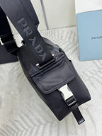 Prada dark nylon shoulder strap with embossed lettering and adjustable buckle.