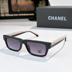 Black square sunglasses with purple lenses and Chanel logo on temple