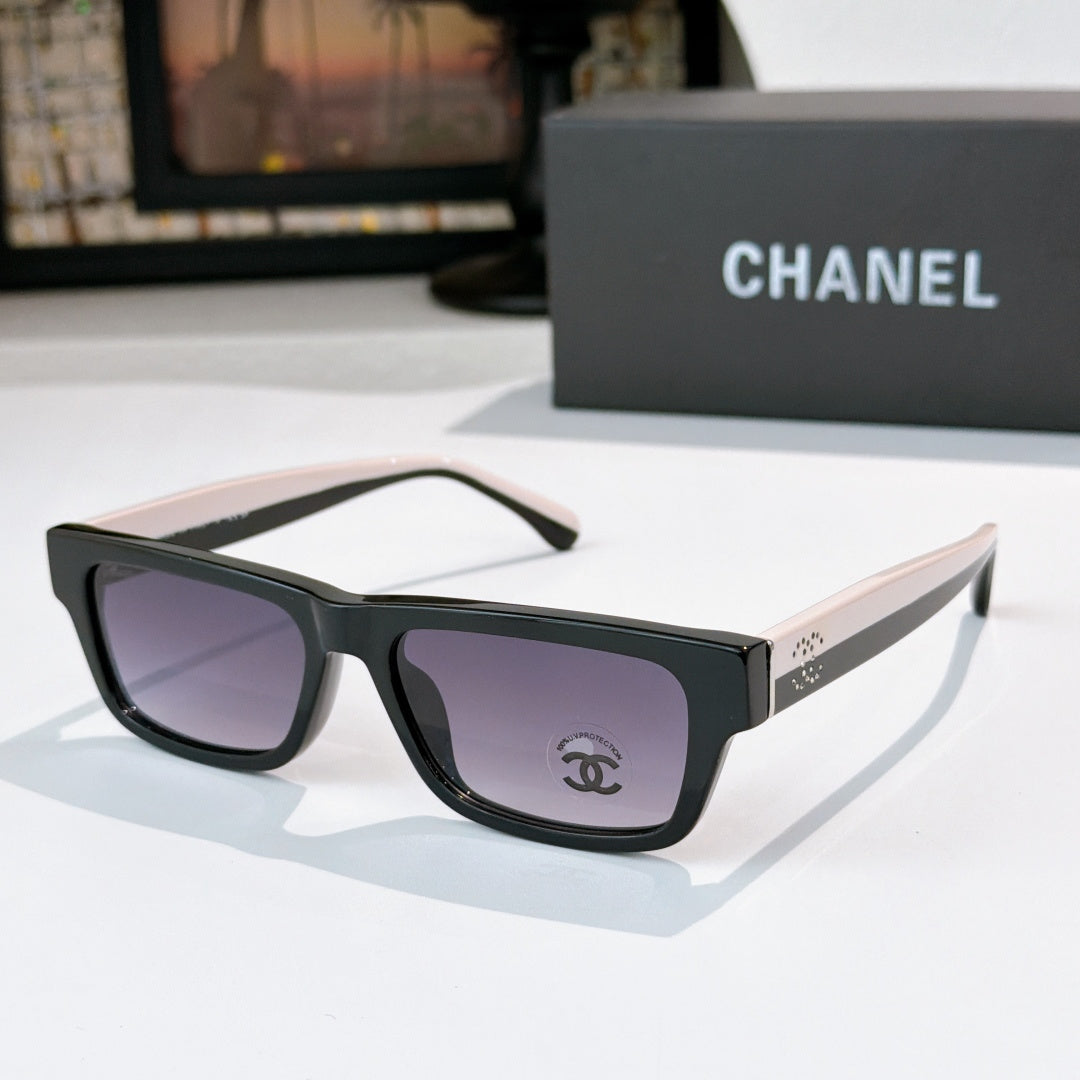 Black square sunglasses with purple lenses and Chanel logo on temple