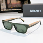 Green square sunglasses with green-tinted lenses and Chanel logo at temple