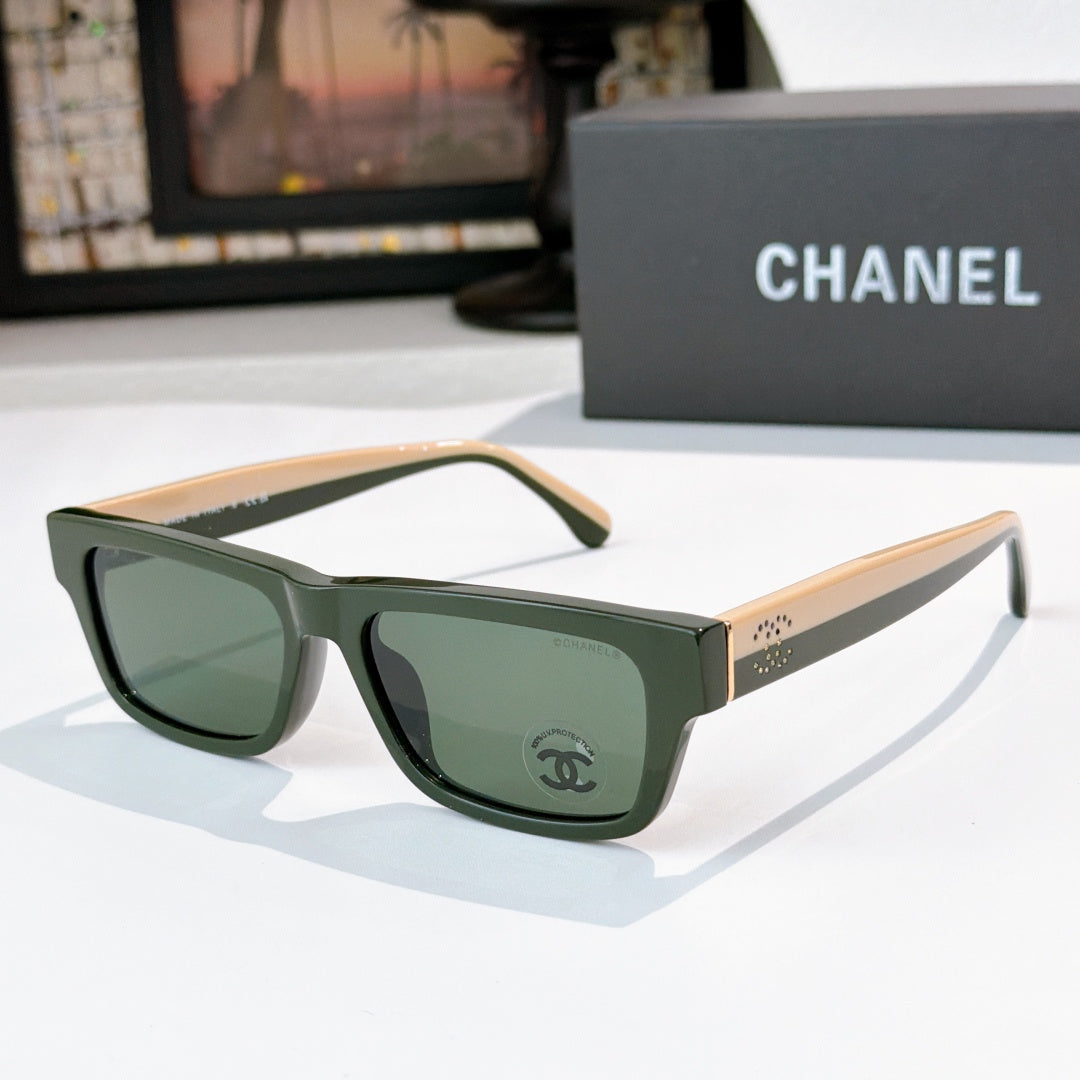 Green square sunglasses with green-tinted lenses and Chanel logo at temple