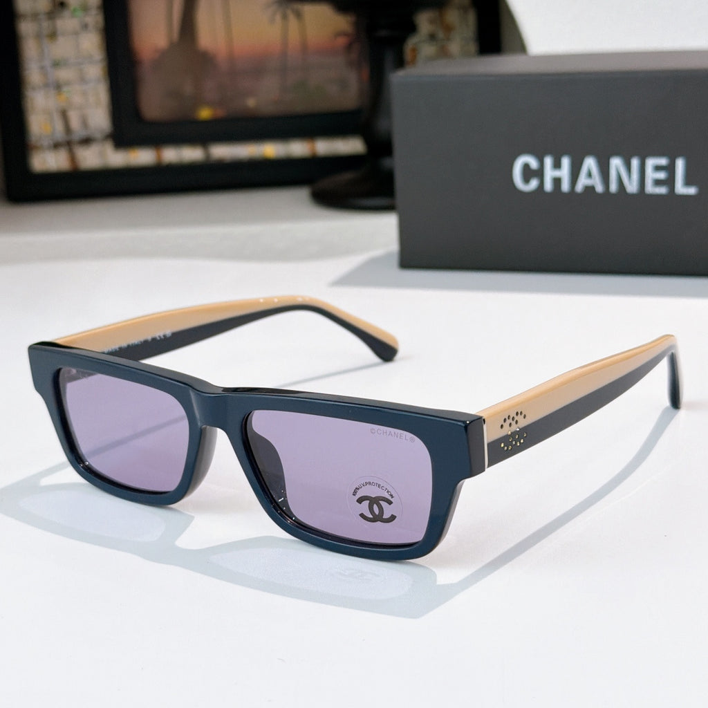 Dark blue square sunglasses with lavender lenses and Chanel logo at front