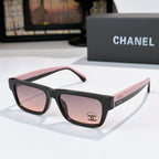 Black sunglasses with pink-tinted lenses and Chanel logo on temple