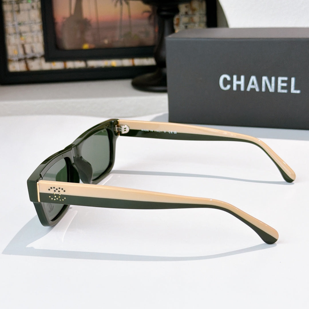Olive sunglasses, side view, with perforated temple details and Chanel logo