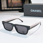 Dark square sunglasses with smoky lenses and Chanel logo at front