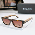Tortoiseshell square sunglasses with rose-tinted lenses and Chanel logo at temple
