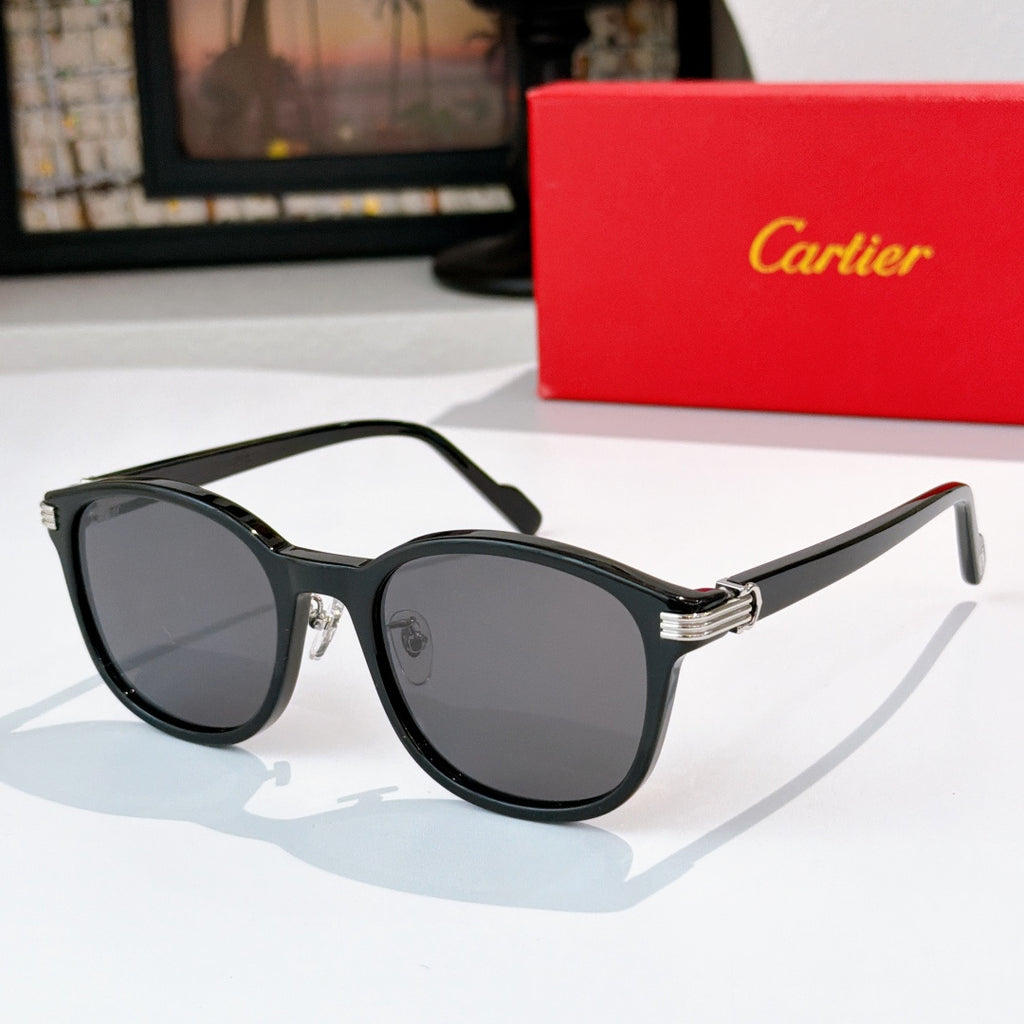 Cartier sunglasses with dark lenses and black frames
