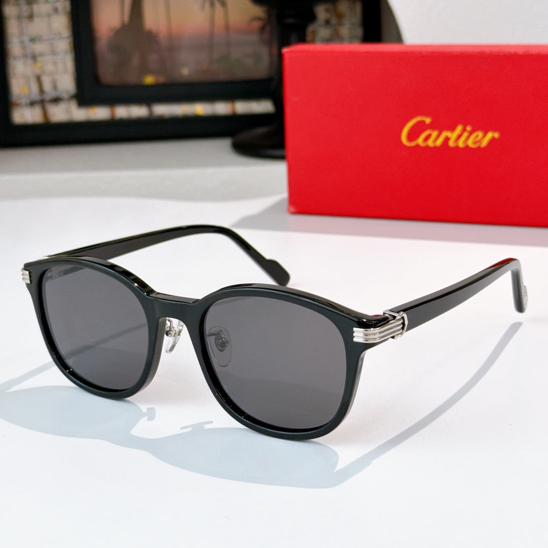 Cartier sunglasses with dark lenses and black frames